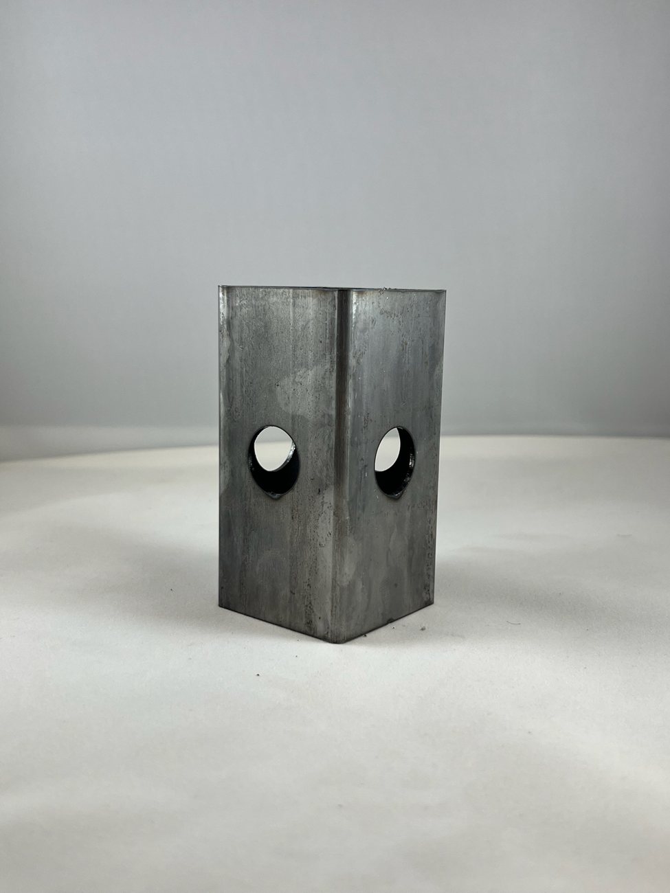 Square tube with intersecting round holes cut on tube laser