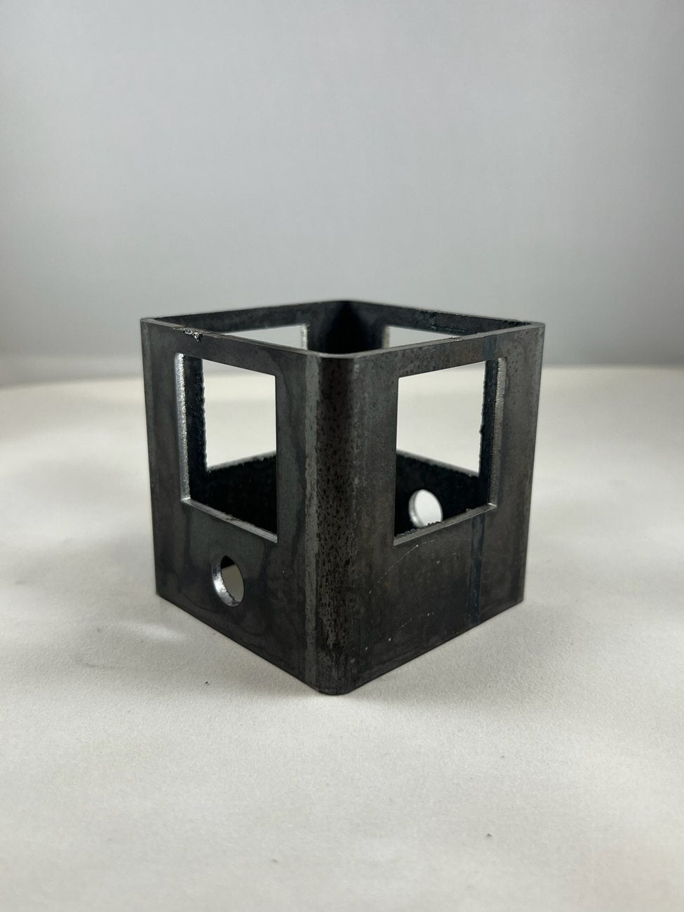 Square tube with cut windows and holes